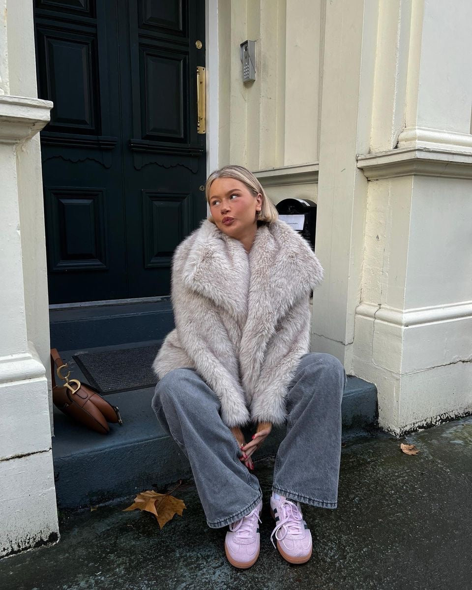 Adele faux fur oversized coat in plush synthetic fibres with wide lapel collar, concealed front and relaxed silhouette. Warm, durable and cruelty-free outerwear that layers over jeans, dresses and evening looks for chic winter style.