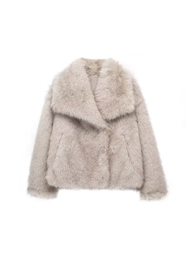 Adele faux fur oversized coat in plush synthetic fibres with wide lapel collar, concealed front and relaxed silhouette. Warm, durable and cruelty-free outerwear that layers over jeans, dresses and evening looks for chic winter style.