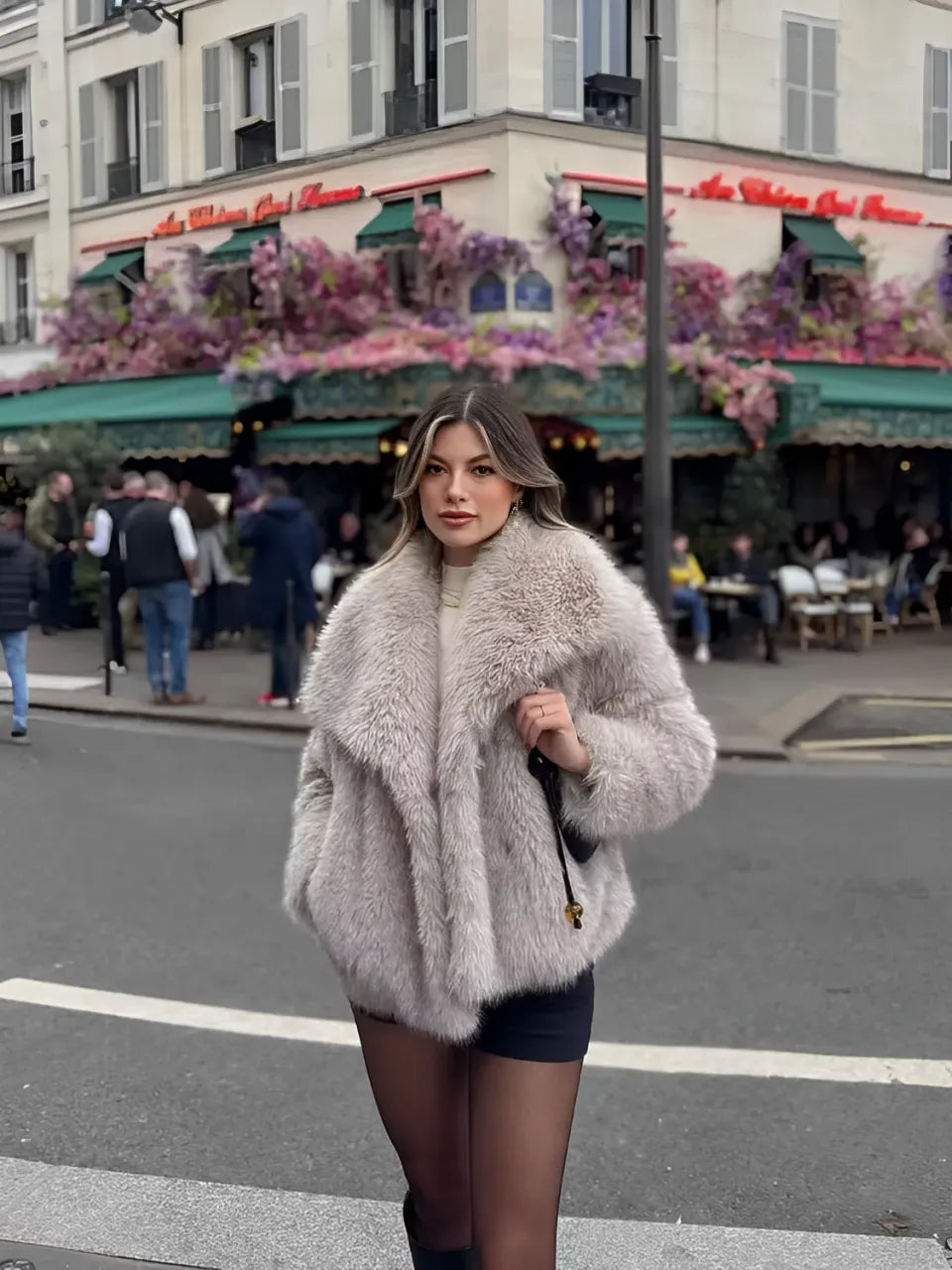 Adele faux fur oversized coat in plush synthetic fibres with wide lapel collar, concealed front and relaxed silhouette. Warm, durable and cruelty-free outerwear that layers over jeans, dresses and evening looks for chic winter style.