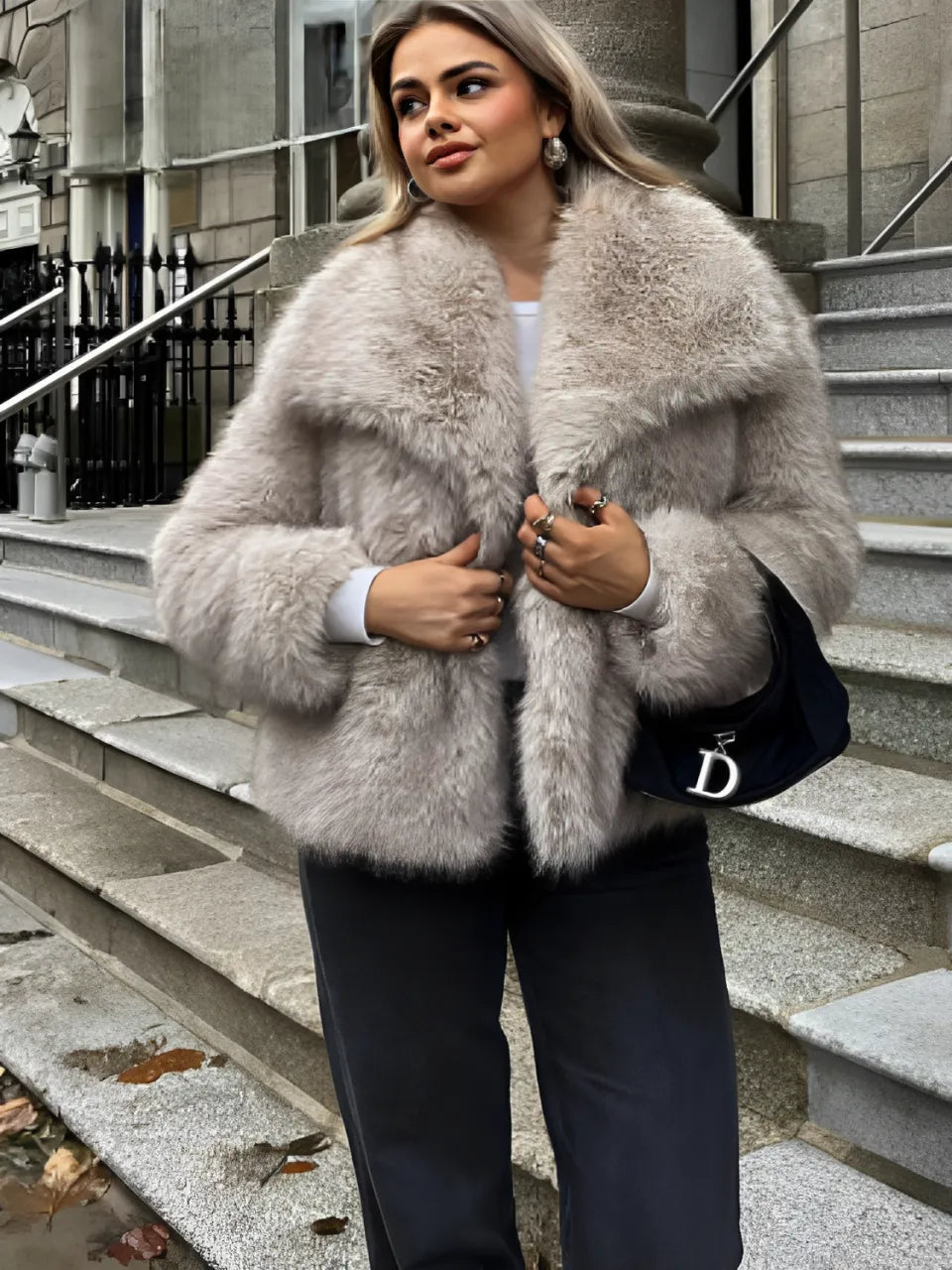 Adele faux fur oversized coat in plush synthetic fibres with wide lapel collar, concealed front and relaxed silhouette. Warm, durable and cruelty-free outerwear that layers over jeans, dresses and evening looks for chic winter style.