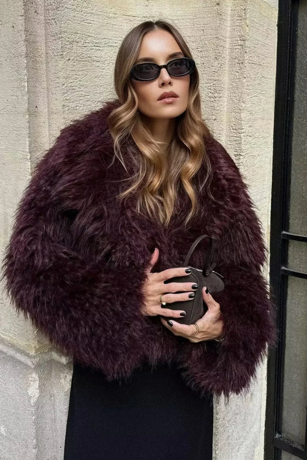 Adele faux fur oversized coat in plush synthetic fibres with wide lapel collar, concealed front and relaxed silhouette. Warm, durable and cruelty-free outerwear that layers over jeans, dresses and evening looks for chic winter style.