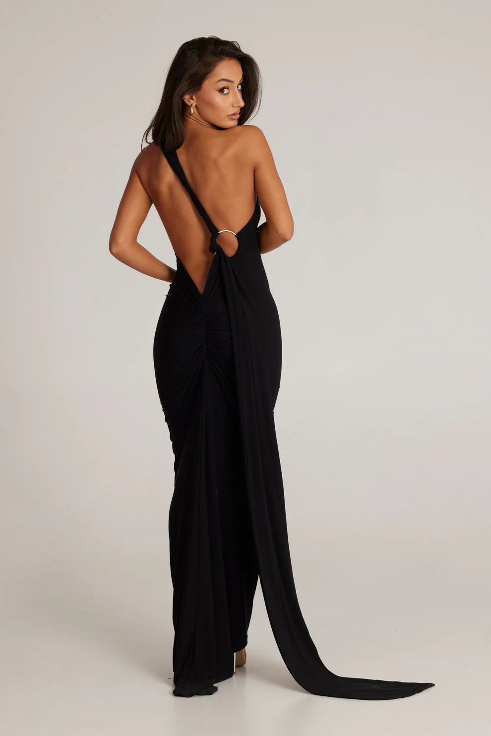 Abby backless maxi dress featuring a one-shoulder neckline, floor-length silhouette, subtle side slit and fluid drape. Stretch fabric molds to the body with a soft lining for coverage. Cotton, polyester, elastane blend—ideal for formal events.