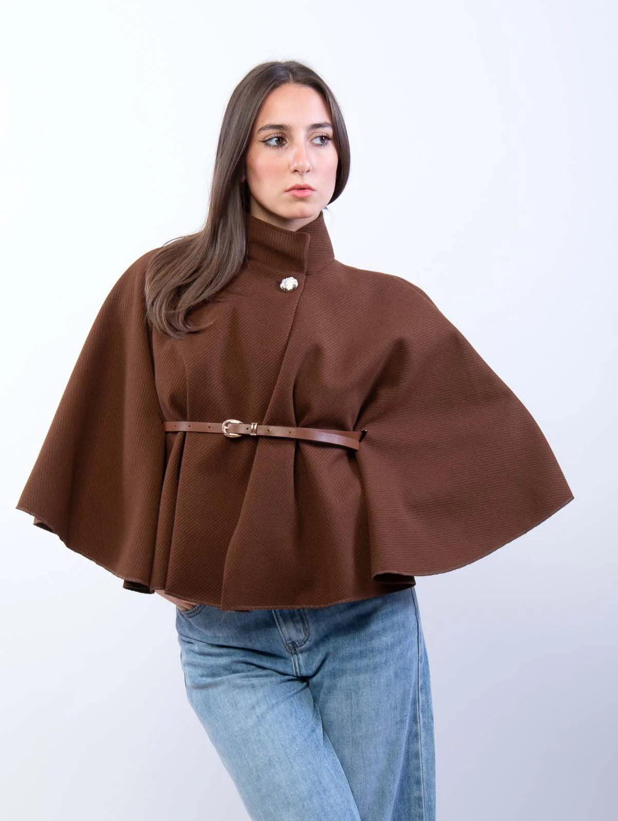 Adele wool-blend poncho belted cape coat featuring a flowing cape silhouette, high stand collar, single front button and slim waist belt. Soft, durable and warm outer layer that drapes smoothly over knitwear, dresses or tailored outfits.
