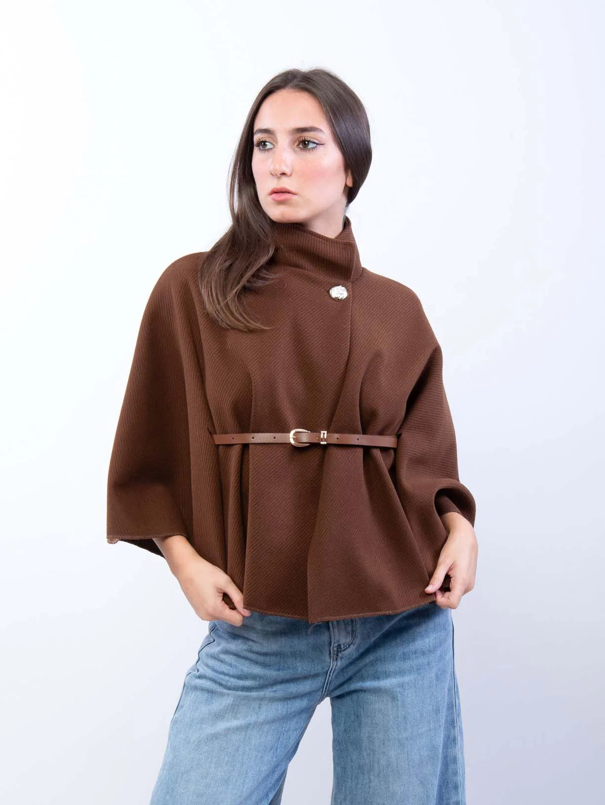 Adele wool-blend poncho belted cape coat featuring a flowing cape silhouette, high stand collar, single front button and slim waist belt. Soft, durable and warm outer layer that drapes smoothly over knitwear, dresses or tailored outfits.