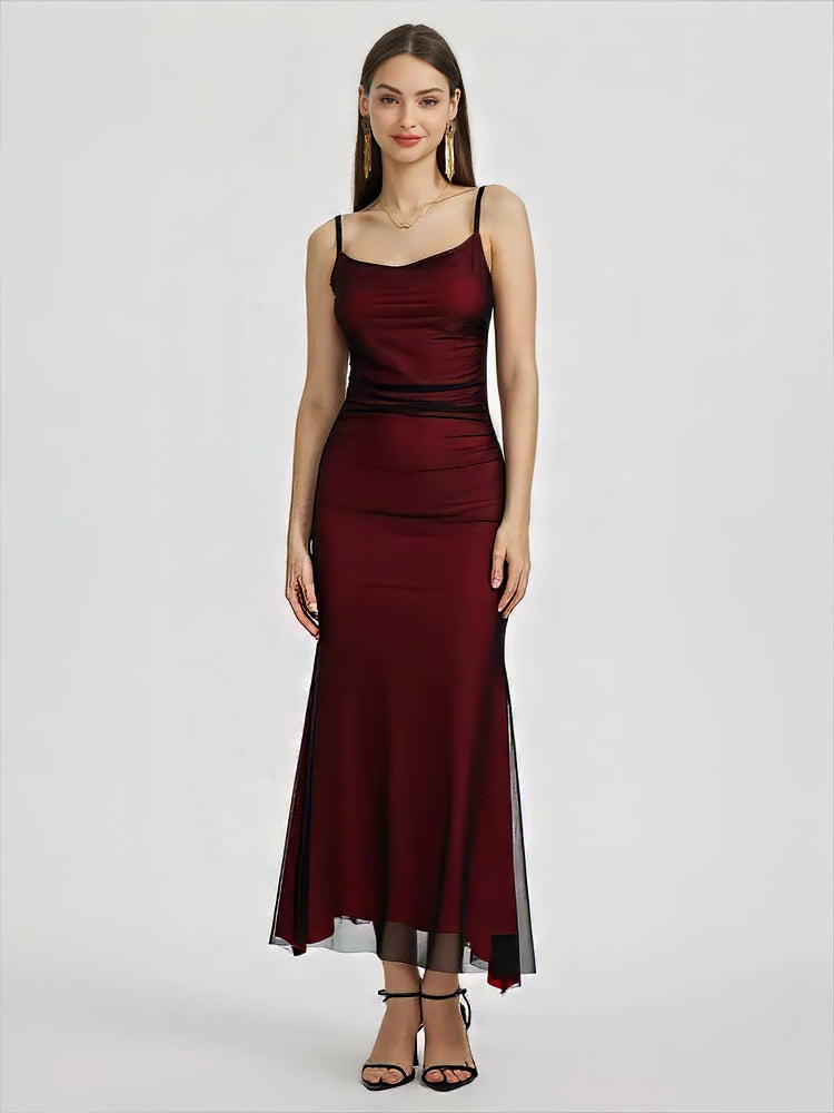 Adriana Tulle Maxi Dress featuring a sleek, floor-grazing silhouette with soft drape that defines the waist and flatters the hips. Stretch tulle in a cotton, polyester and elastane blend adapts to the body for smooth, elegant evening wear.