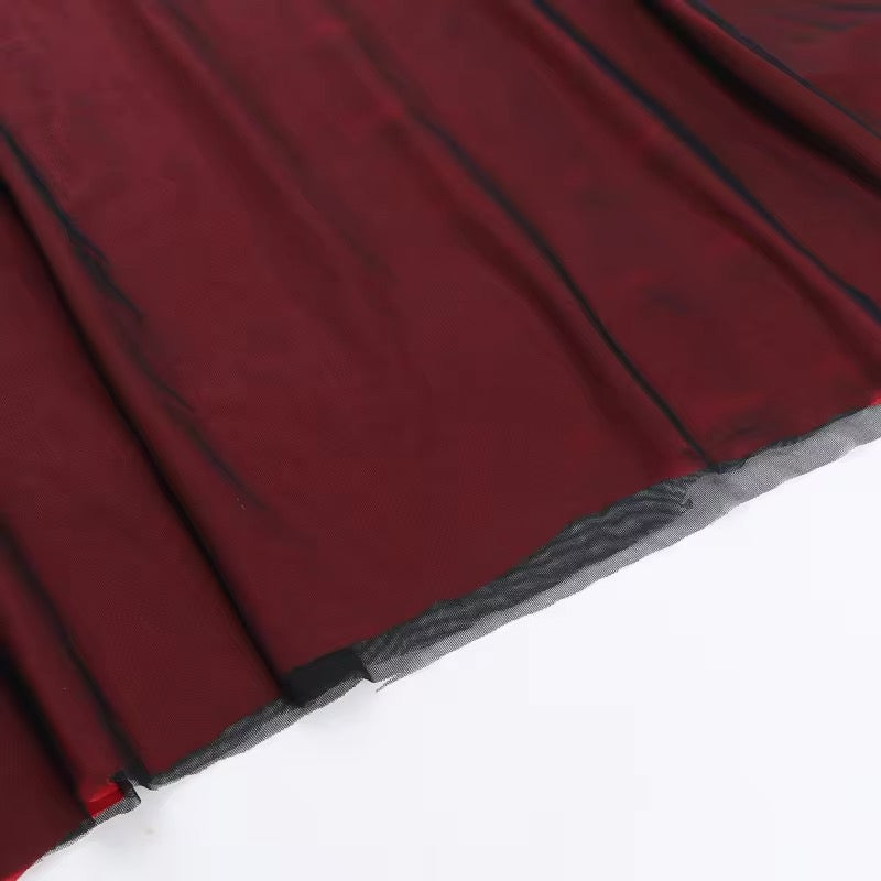 Adriana Tulle Maxi Dress featuring a sleek, floor-grazing silhouette with soft drape that defines the waist and flatters the hips. Stretch tulle in a cotton, polyester and elastane blend adapts to the body for smooth, elegant evening wear.