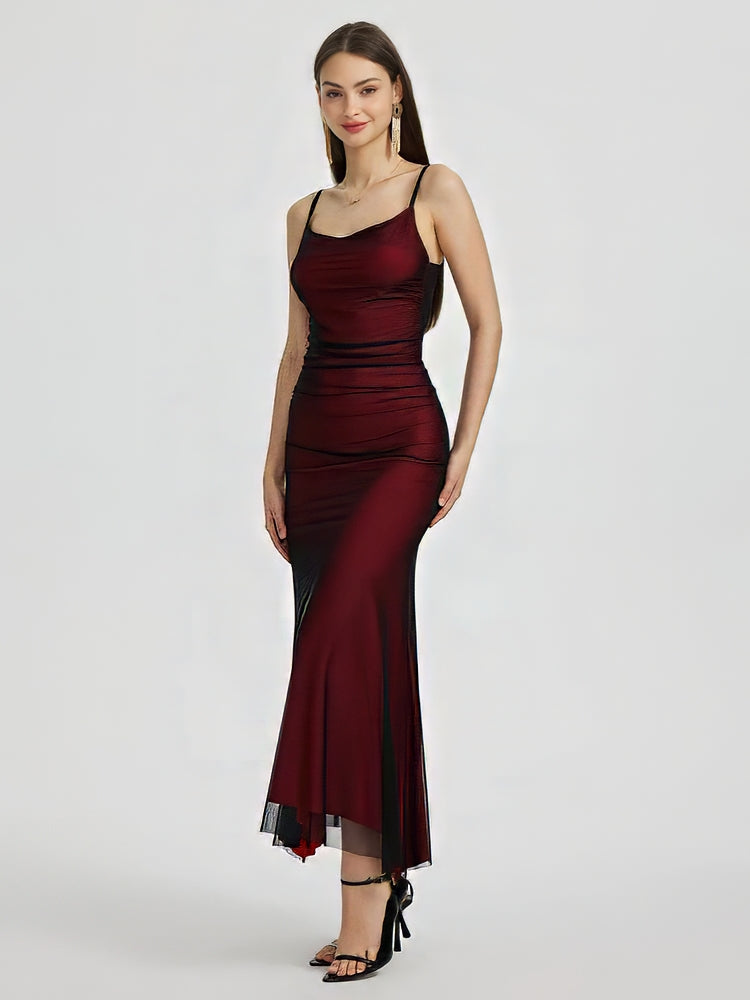 Adriana Tulle Maxi Dress featuring a sleek, floor-grazing silhouette with soft drape that defines the waist and flatters the hips. Stretch tulle in a cotton, polyester and elastane blend adapts to the body for smooth, elegant evening wear.