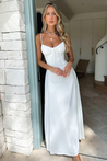 Maxi dress with delicate straps, ruched bust and lace-up back for a custom fit, finished with a flowing A-line skirt. Lightweight, breathable fabric offers graceful movement for weddings, soirées, parties or elegant daytime wear.