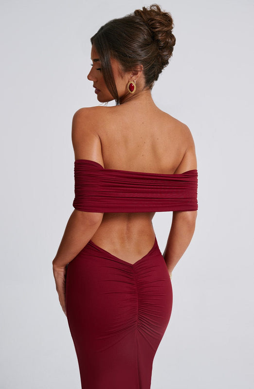 Amanda Backless Maxi Dress: off-shoulder, floor-length silhouette with V-shaped open back. Cotton, polyester and elastane blend molds to the body with a light, smoothing drape that defines the waist and flatters hip curves for elegant events.