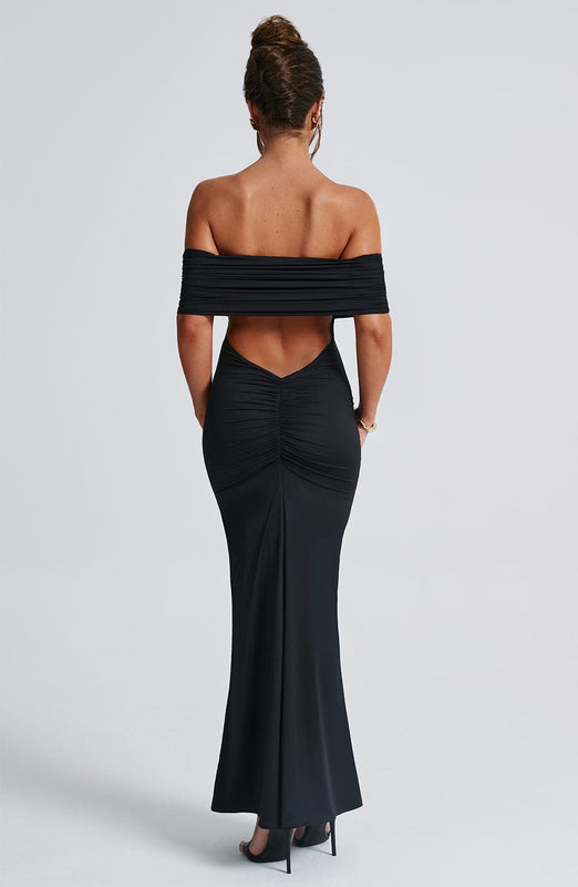 Amanda Backless Maxi Dress: off-shoulder, floor-length silhouette with V-shaped open back. Cotton, polyester and elastane blend molds to the body with a light, smoothing drape that defines the waist and flatters hip curves for elegant events.