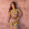 Amaris floral print two piece set featuring a short-sleeve cropped top and matching column maxi skirt in multicolor yellow, pink and grey. Body-skimming silhouette with a lightweight feel, ideal for casual days, brunch and vacations.
