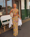 Amaris floral print two piece set featuring a short-sleeve cropped top and matching column maxi skirt in multicolor yellow, pink and grey. Body-skimming silhouette with a lightweight feel, ideal for casual days, brunch and vacations.