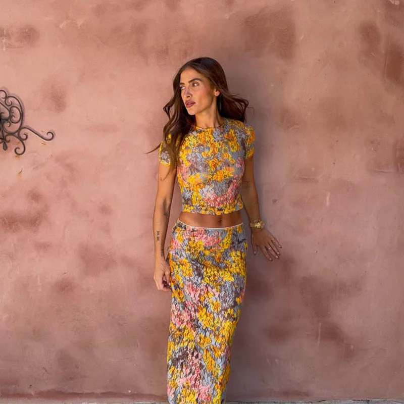 Amaris floral print two piece set featuring a short-sleeve cropped top and matching column maxi skirt in multicolor yellow, pink and grey. Body-skimming silhouette with a lightweight feel, ideal for casual days, brunch and vacations.