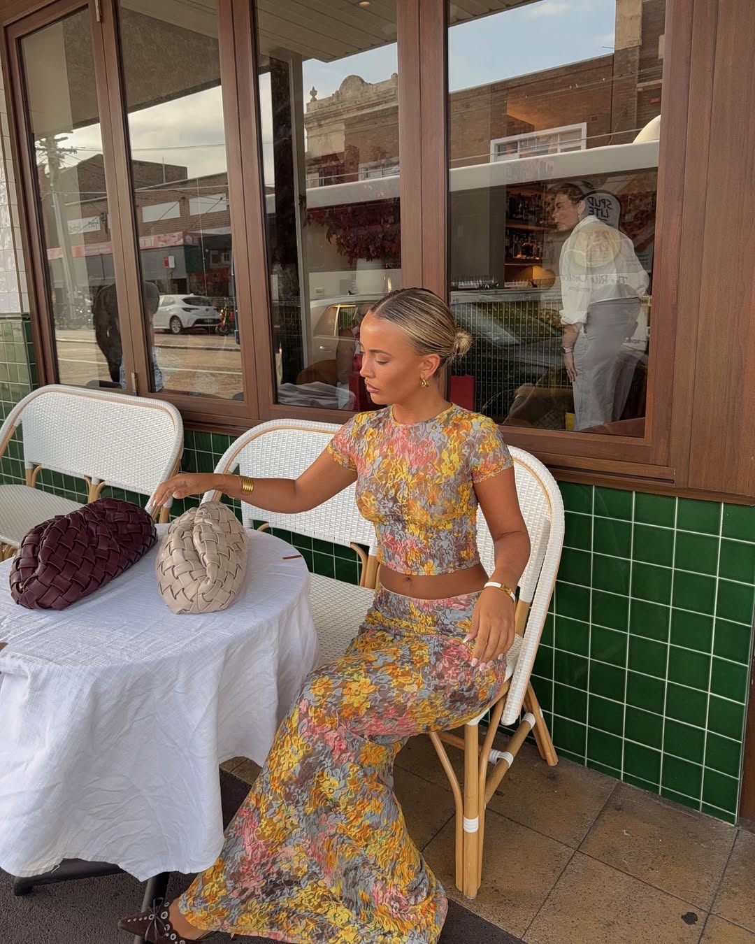 Amaris floral print two piece set featuring a short-sleeve cropped top and matching column maxi skirt in multicolor yellow, pink and grey. Body-skimming silhouette with a lightweight feel, ideal for casual days, brunch and vacations.