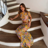 Amaris floral print two piece set featuring a short-sleeve cropped top and matching column maxi skirt in multicolor yellow, pink and grey. Body-skimming silhouette with a lightweight feel, ideal for casual days, brunch and vacations.