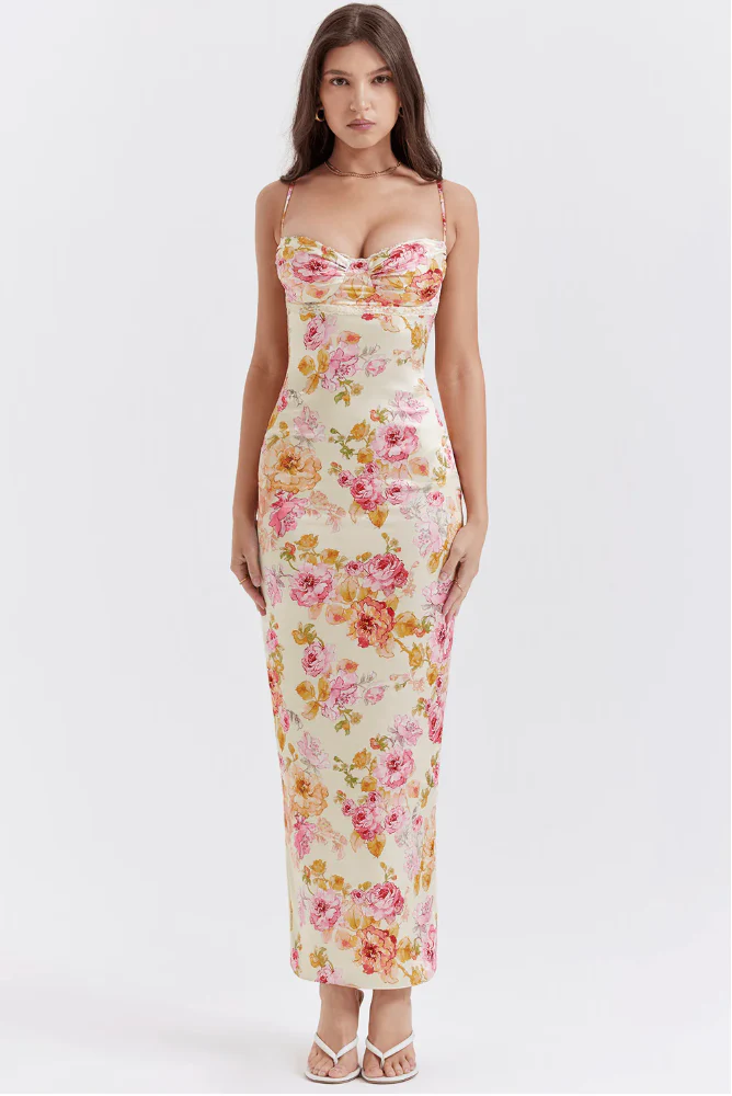 Amelia Charming Floral Maxi Dress in lightweight polyester with all-over floral print. High-waisted, figure-flattering fit with subtle pleating and spaghetti straps; elegant for garden parties, dinners, and daytime occasions.