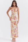 Amelia Charming Floral Maxi Dress in lightweight polyester with all-over floral print. High-waisted, figure-flattering fit with subtle pleating and spaghetti straps; elegant for garden parties, dinners, and daytime occasions.