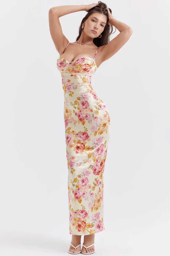 Amelia Charming Floral Maxi Dress in lightweight polyester with all-over floral print. High-waisted, figure-flattering fit with subtle pleating and spaghetti straps; elegant for garden parties, dinners, and daytime occasions.
