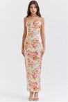 Amelia Charming Floral Maxi Dress in lightweight polyester with all-over floral print. High-waisted, figure-flattering fit with subtle pleating and spaghetti straps; elegant for garden parties, dinners, and daytime occasions.