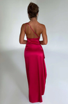 Aurora satin slit maxi dress featuring a one-shoulder neckline, backless silhouette, and fluid side slit. Made from a cotton–polyester–elastane satin blend that molds to the body with a smooth, lightweight drape for weddings, galas, and evening occasions.