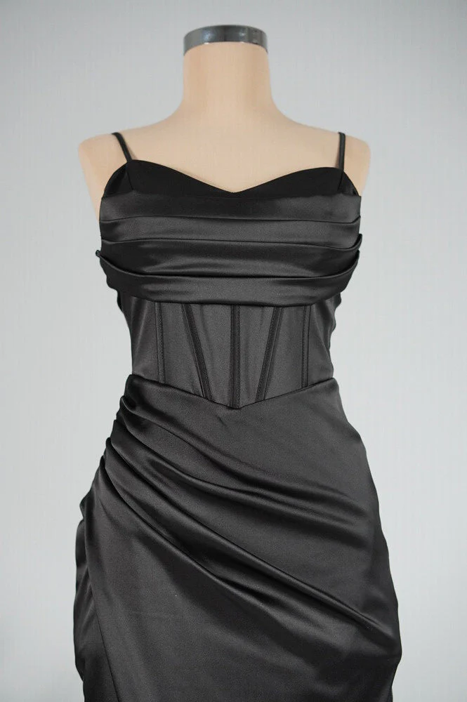 Bella satin corset slit gown featuring slim straps, a corset-style bodice and thigh-high slit. Gentle ruching defines the waist while stretch and a light drape contour the body without showing folds. Composition: Cotton, Polyester, Elastane, Satin.