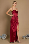 Bella satin corset slit gown featuring slim straps, a corset-style bodice and thigh-high slit. Gentle ruching defines the waist while stretch and a light drape contour the body without showing folds. Composition: Cotton, Polyester, Elastane, Satin.