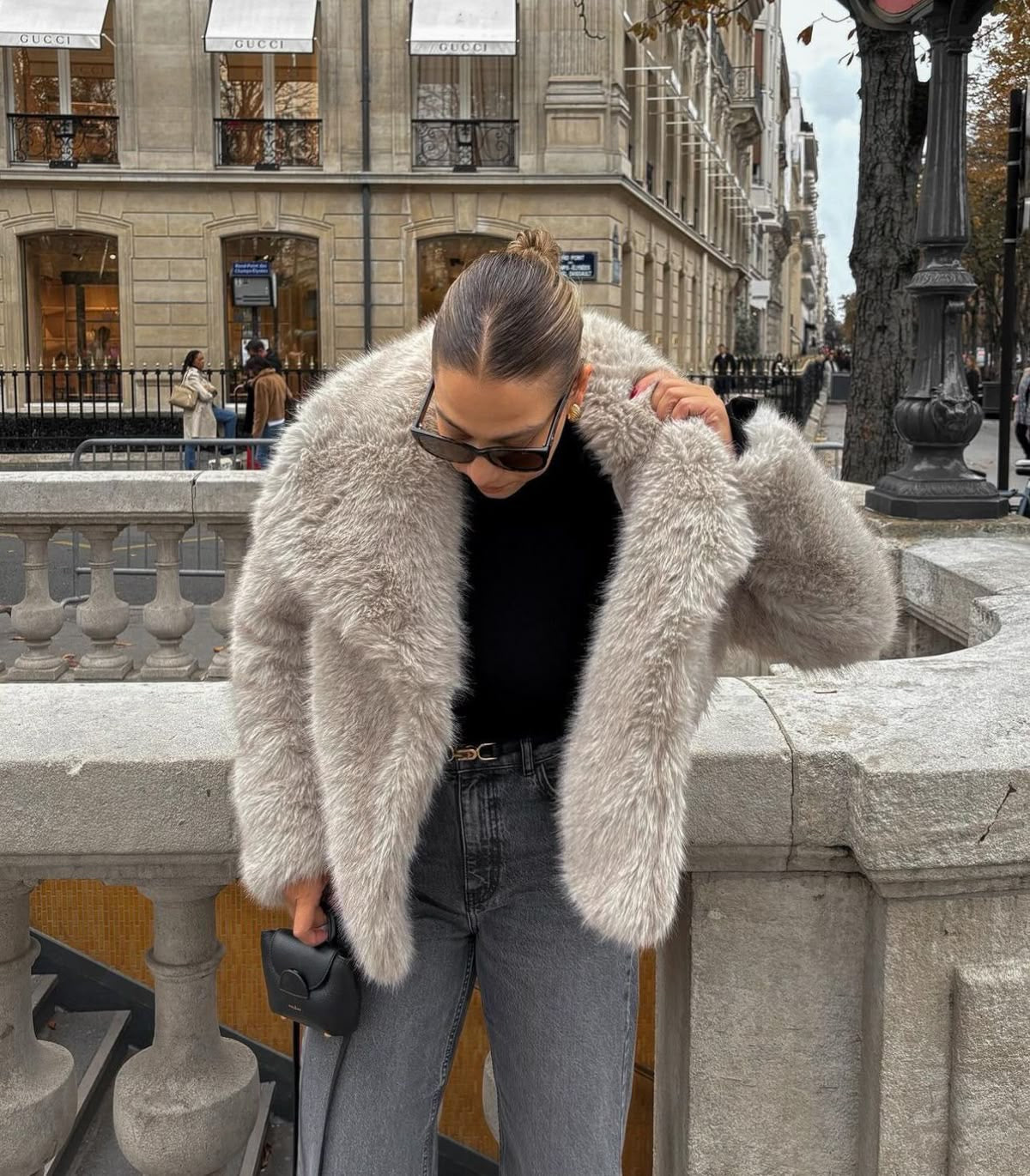 Adele faux fur oversized coat in plush synthetic fibres with wide lapel collar, concealed front and relaxed silhouette. Warm, durable and cruelty-free outerwear that layers over jeans, dresses and evening looks for chic winter style.