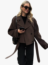 Camille cropped trench jacket in brown wool blend featuring wide lapels, double-breasted buttons, epaulettes and adjustable cuff tabs. Soft, structured fabric and a waist-flattering length for refined layering over knits, dresses or trousers.