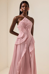 Catherine Ruffle Dress: long asymmetric gown with delicate halter straps, sculpting bodice and cascading pleated ruffles; lightweight chiffon-like polyester with subtle sheen and fluid motion, delivered with a free pearl clutch bag.