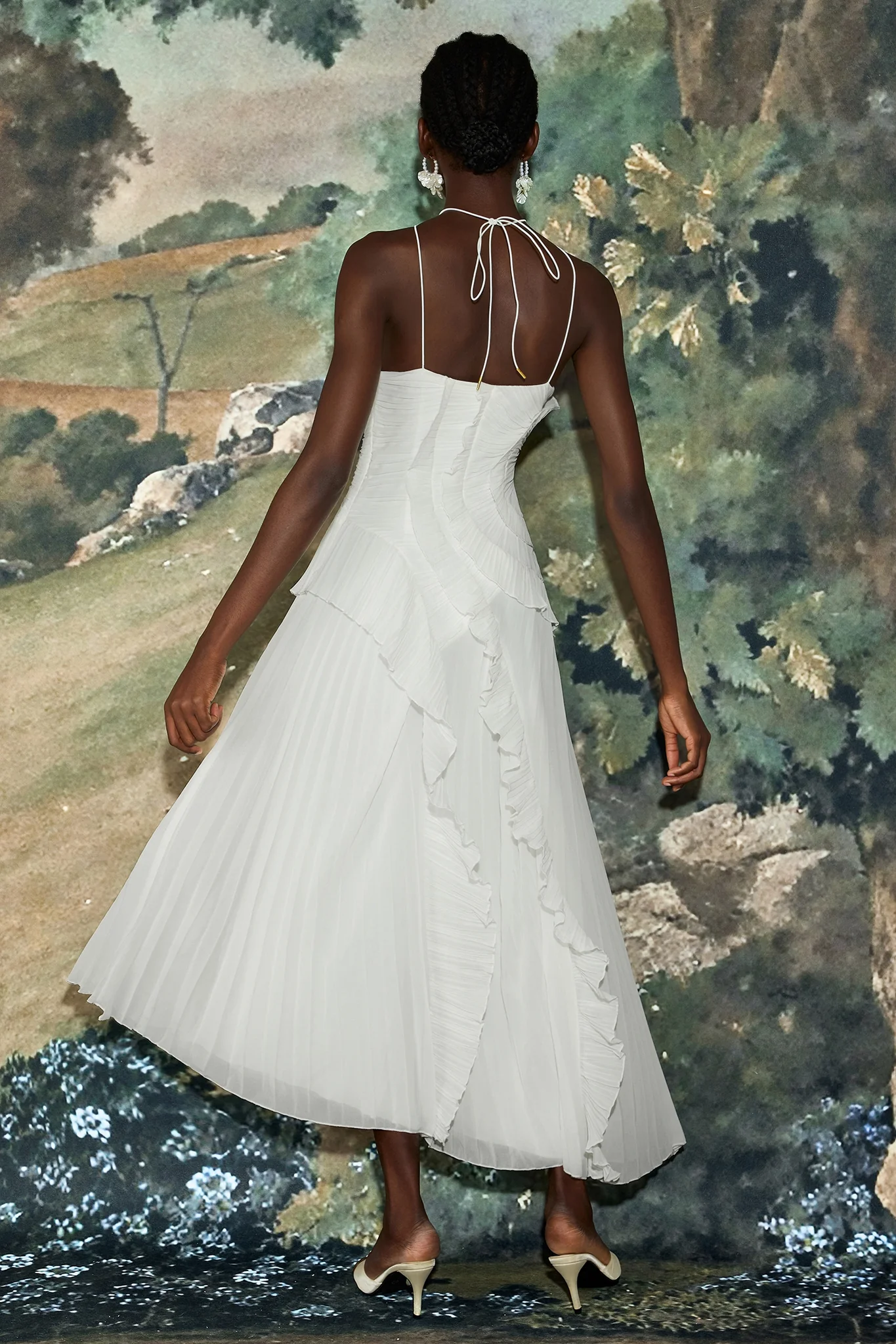 Catherine Ruffle Dress: long asymmetric gown with delicate halter straps, sculpting bodice and cascading pleated ruffles; lightweight chiffon-like polyester with subtle sheen and fluid motion, delivered with a free pearl clutch bag.