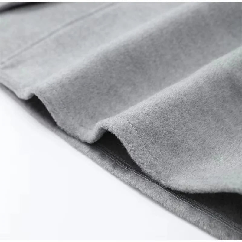 Celine wool-blend belted coat featuring a wrap front, wide lapels and waist-defining tie belt with statement faux fur cuffs. Soft, warm and durable outer layer that elevates autumn-winter outfits from tailored trousers to knit dresses with Parisian elegance.