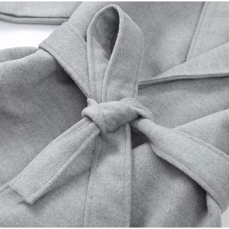 Celine wool-blend belted coat featuring a wrap front, wide lapels and waist-defining tie belt with statement faux fur cuffs. Soft, warm and durable outer layer that elevates autumn-winter outfits from tailored trousers to knit dresses with Parisian elegance.