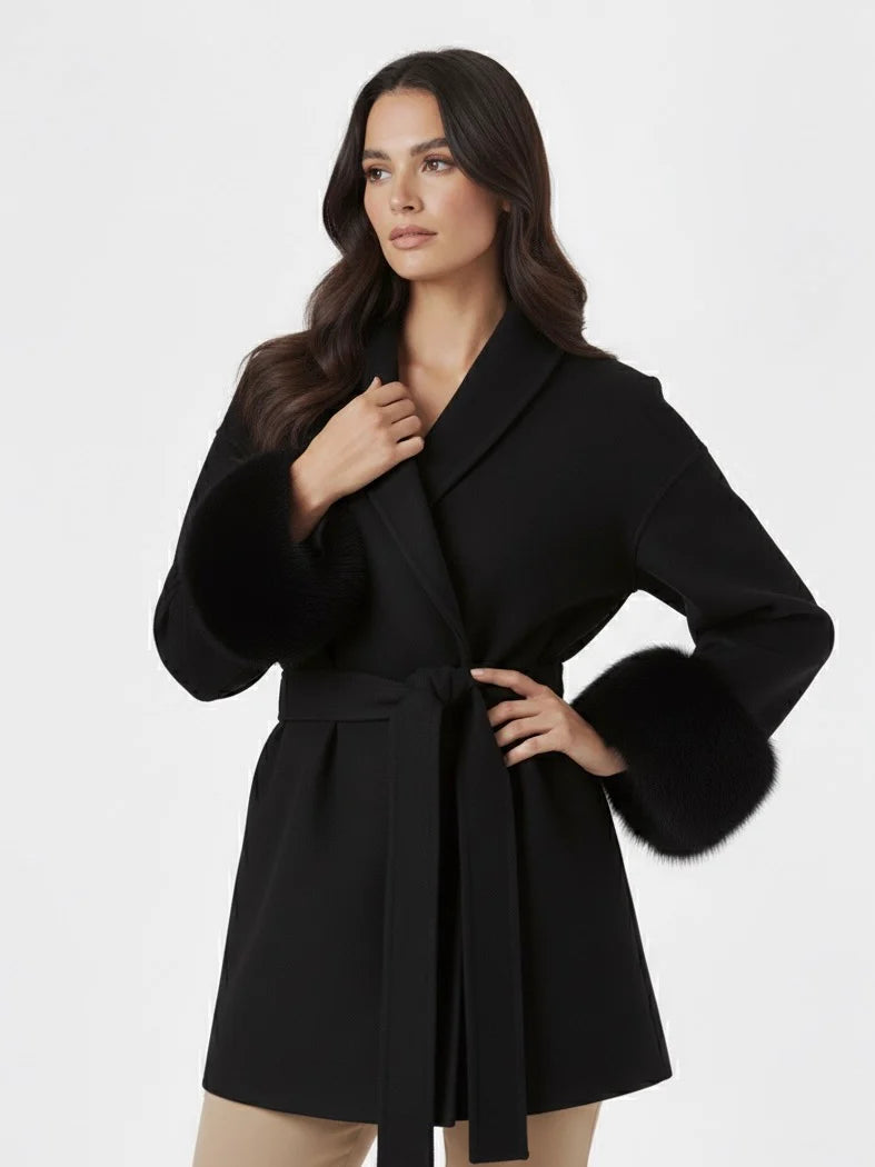 Celine wool-blend belted coat featuring a wrap front, wide lapels and waist-defining tie belt with statement faux fur cuffs. Soft, warm and durable outer layer that elevates autumn-winter outfits from tailored trousers to knit dresses with Parisian elegance.
