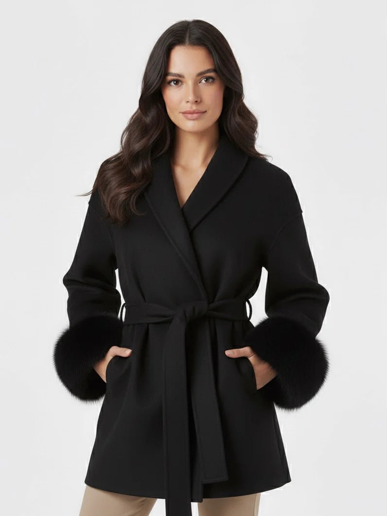 Celine wool-blend belted coat featuring a wrap front, wide lapels and waist-defining tie belt with statement faux fur cuffs. Soft, warm and durable outer layer that elevates autumn-winter outfits from tailored trousers to knit dresses with Parisian elegance.