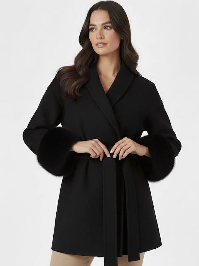 Celine wool-blend belted coat featuring a wrap front, wide lapels and waist-defining tie belt with statement faux fur cuffs. Soft, warm and durable outer layer that elevates autumn-winter outfits from tailored trousers to knit dresses with Parisian elegance.