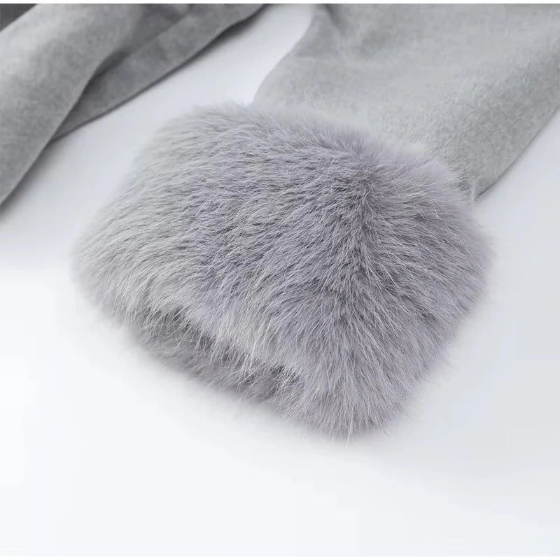 Celine wool-blend belted coat featuring a wrap front, wide lapels and waist-defining tie belt with statement faux fur cuffs. Soft, warm and durable outer layer that elevates autumn-winter outfits from tailored trousers to knit dresses with Parisian elegance.