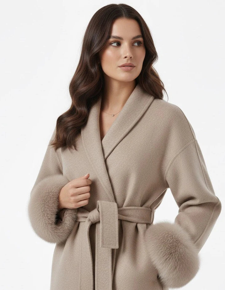 Celine wool-blend belted coat featuring a wrap front, wide lapels and waist-defining tie belt with statement faux fur cuffs. Soft, warm and durable outer layer that elevates autumn-winter outfits from tailored trousers to knit dresses with Parisian elegance.