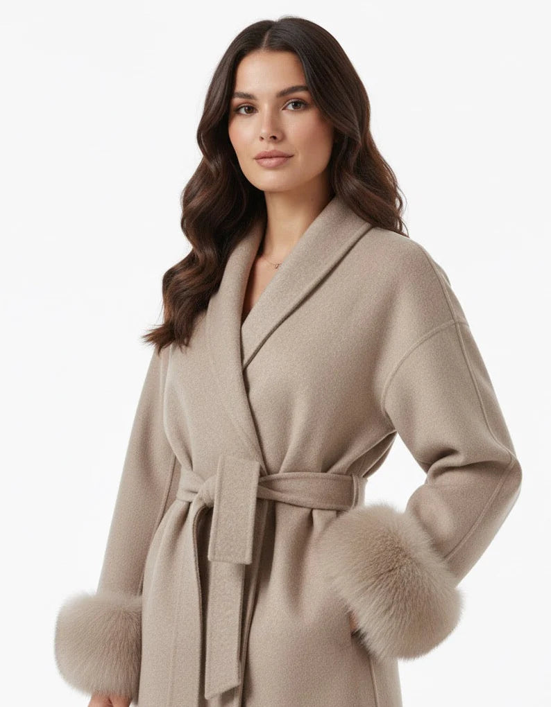 Celine wool-blend belted coat featuring a wrap front, wide lapels and waist-defining tie belt with statement faux fur cuffs. Soft, warm and durable outer layer that elevates autumn-winter outfits from tailored trousers to knit dresses with Parisian elegance.