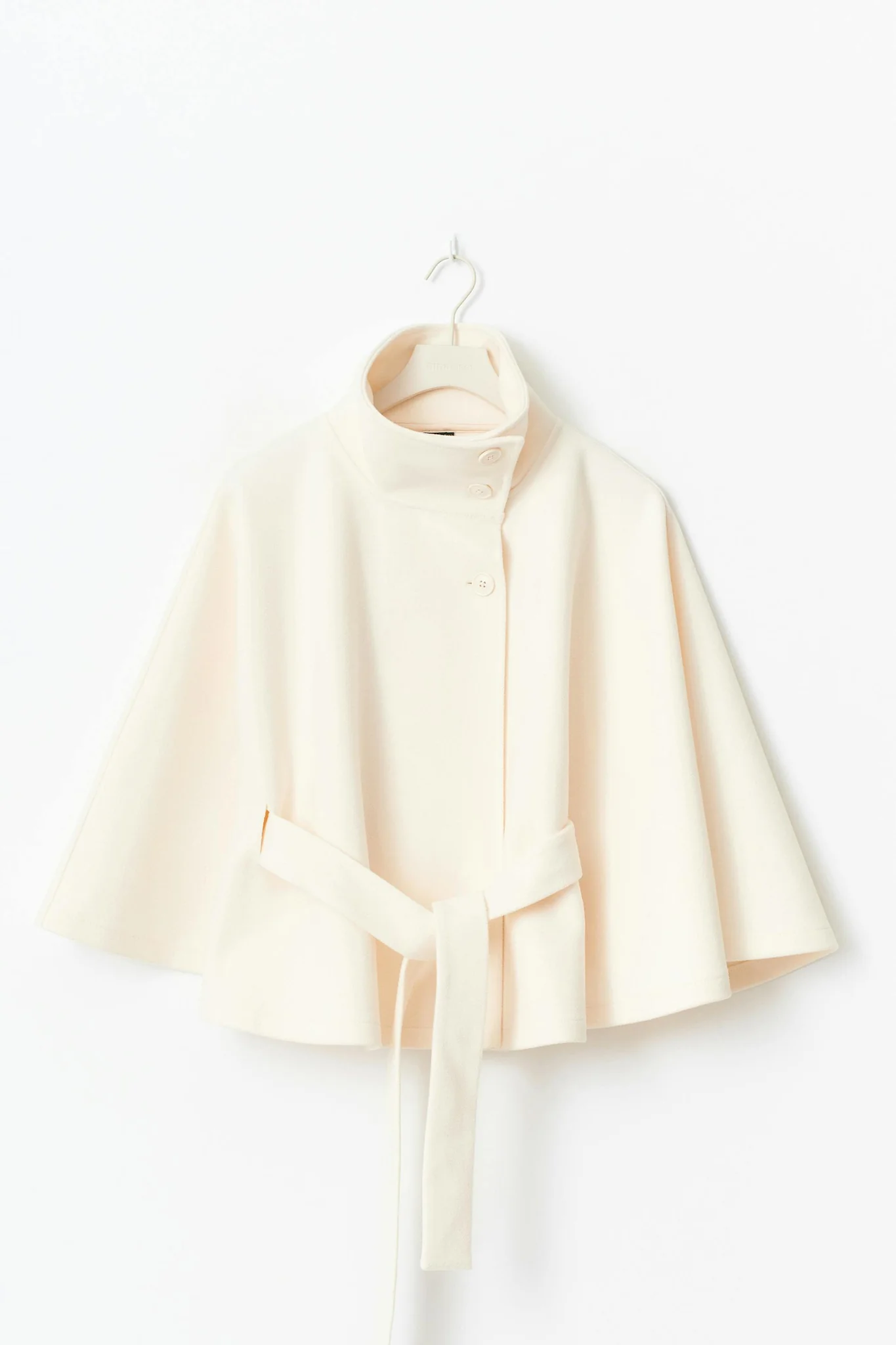 Chloe 2-Pack Cape Bundle featuring two belted capes with high-neck collars, buttoned fronts and detachable waist ties. Soft-touch fabric, flowing drape and versatile colors ideal for layering over dresses, denim or tailored looks.