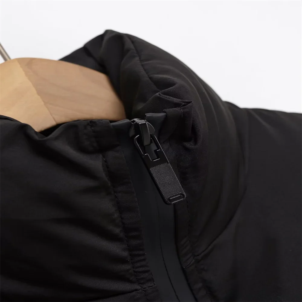 Claire cropped puffer jacket in black, featuring a high padded collar, zip fastening, elasticated cuffs and a smooth polyester shell with lightweight fibre filling. Sleek, warm and non-bulky—ideal over high-waist denim, skirts or tailored trousers.