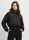 Claire cropped puffer jacket in black, featuring a high padded collar, zip fastening, elasticated cuffs and a smooth polyester shell with lightweight fibre filling. Sleek, warm and non-bulky—ideal over high-waist denim, skirts or tailored trousers.