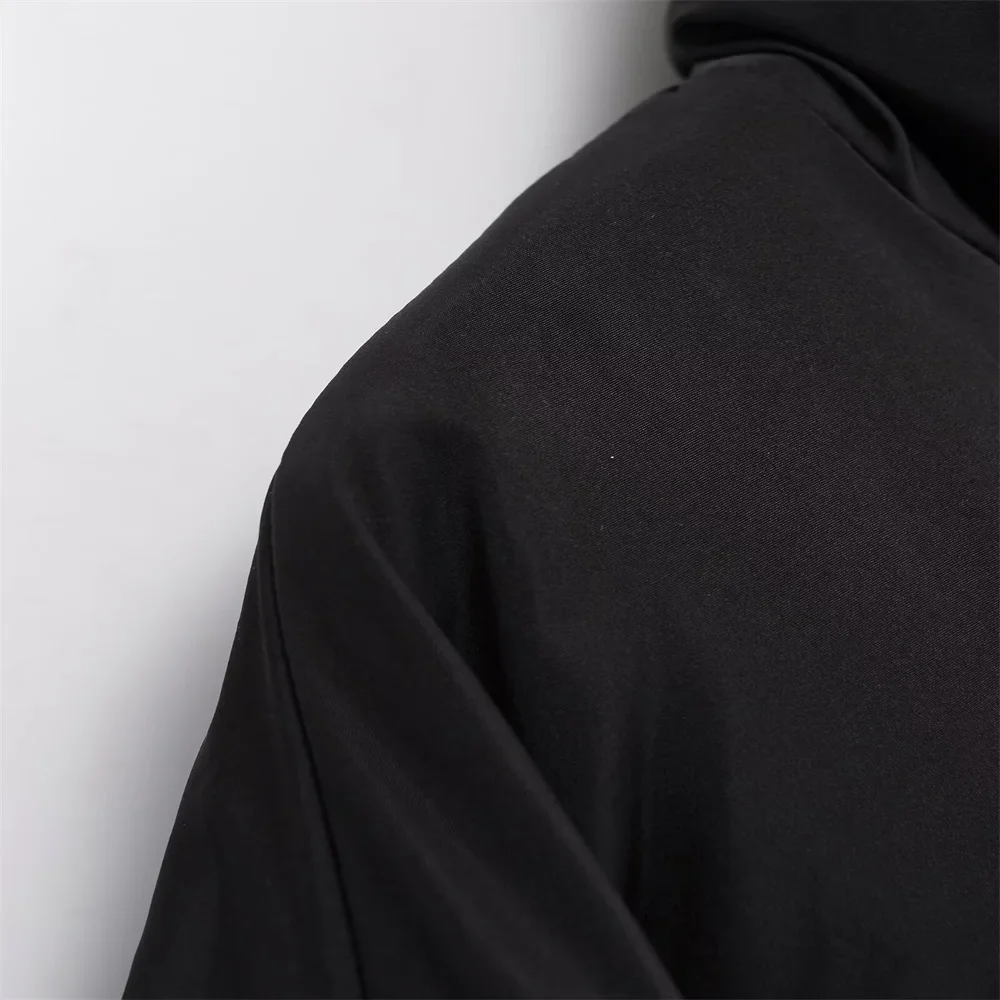 Claire cropped puffer jacket in black, featuring a high padded collar, zip fastening, elasticated cuffs and a smooth polyester shell with lightweight fibre filling. Sleek, warm and non-bulky—ideal over high-waist denim, skirts or tailored trousers.