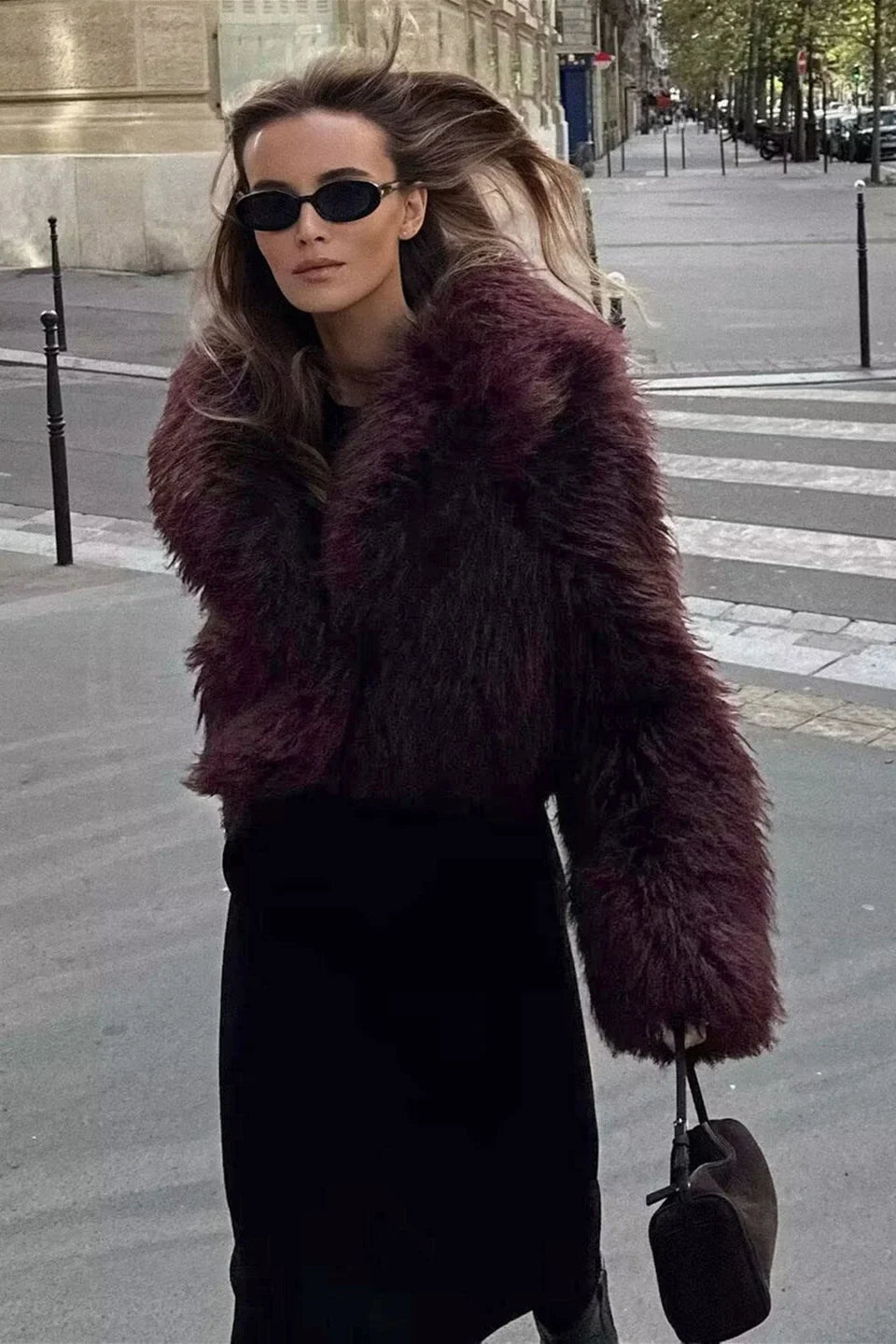 Adele faux fur oversized coat in plush synthetic fibres with wide lapel collar, concealed front and relaxed silhouette. Warm, durable and cruelty-free outerwear that layers over jeans, dresses and evening looks for chic winter style.