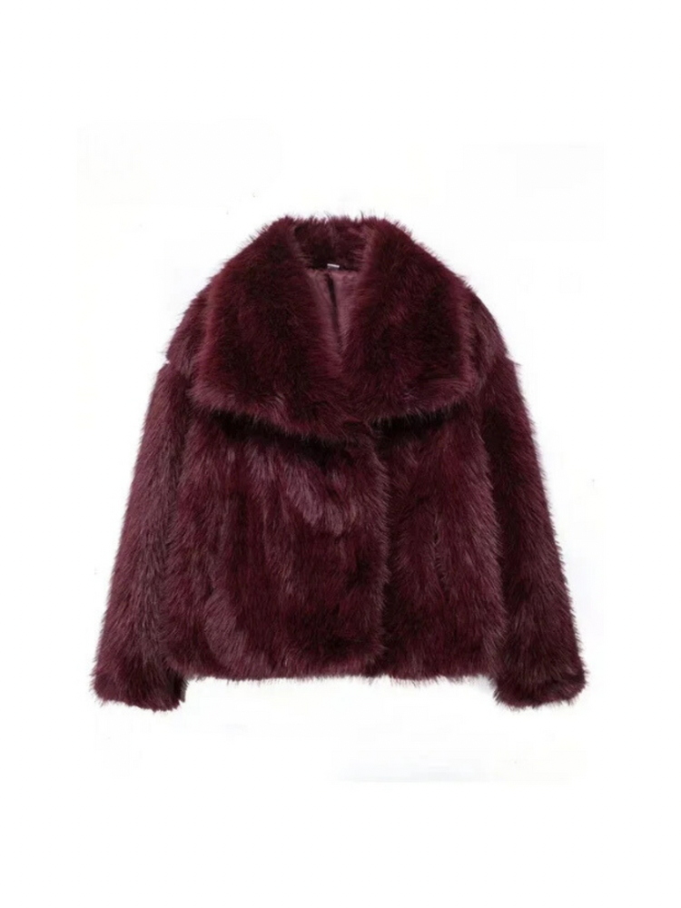 Adele faux fur oversized coat in plush synthetic fibres with wide lapel collar, concealed front and relaxed silhouette. Warm, durable and cruelty-free outerwear that layers over jeans, dresses and evening looks for chic winter style.