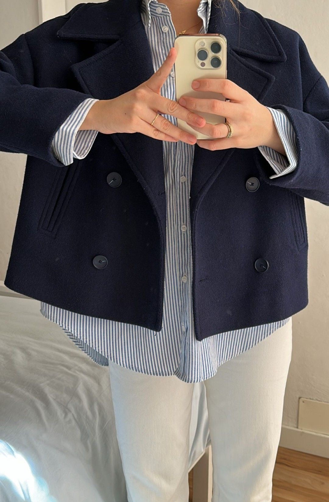 Maya wool-blend double-breasted cropped trench coat in a tailored silhouette with wide lapels and structured shoulders. Warm, durable and comfortable layer for autumn and winter, styled with denim, skirts or trousers.