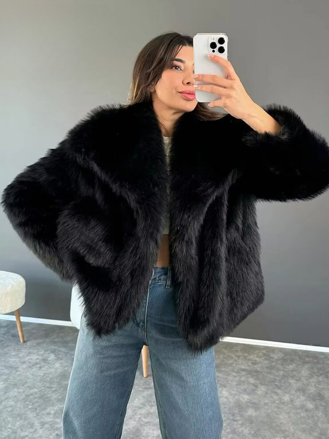 Adele faux fur oversized coat in plush synthetic fibres with wide lapel collar, concealed front and relaxed silhouette. Warm, durable and cruelty-free outerwear that layers over jeans, dresses and evening looks for chic winter style.