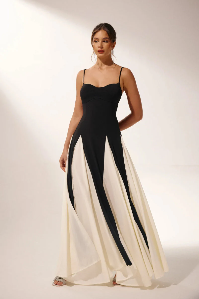 Women’s two-tone contrast maxi dress featuring a contoured black bodice, adjustable slim straps and a fitted waist that releases into an ivory panelled A-line skirt. Smooth, structured polyester shapes the figure; elegant choice for galas and evening events.