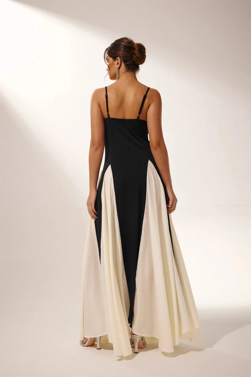 Women’s two-tone contrast maxi dress featuring a contoured black bodice, adjustable slim straps and a fitted waist that releases into an ivory panelled A-line skirt. Smooth, structured polyester shapes the figure; elegant choice for galas and evening events.
