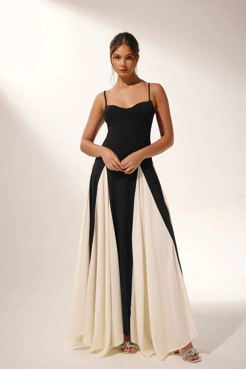 Women’s two-tone contrast maxi dress featuring a contoured black bodice, adjustable slim straps and a fitted waist that releases into an ivory panelled A-line skirt. Smooth, structured polyester shapes the figure; elegant choice for galas and evening events.