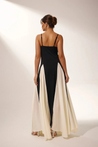 Women’s two-tone contrast maxi dress featuring a contoured black bodice, adjustable slim straps and a fitted waist that releases into an ivory panelled A-line skirt. Smooth, structured polyester shapes the figure; elegant choice for galas and evening events.